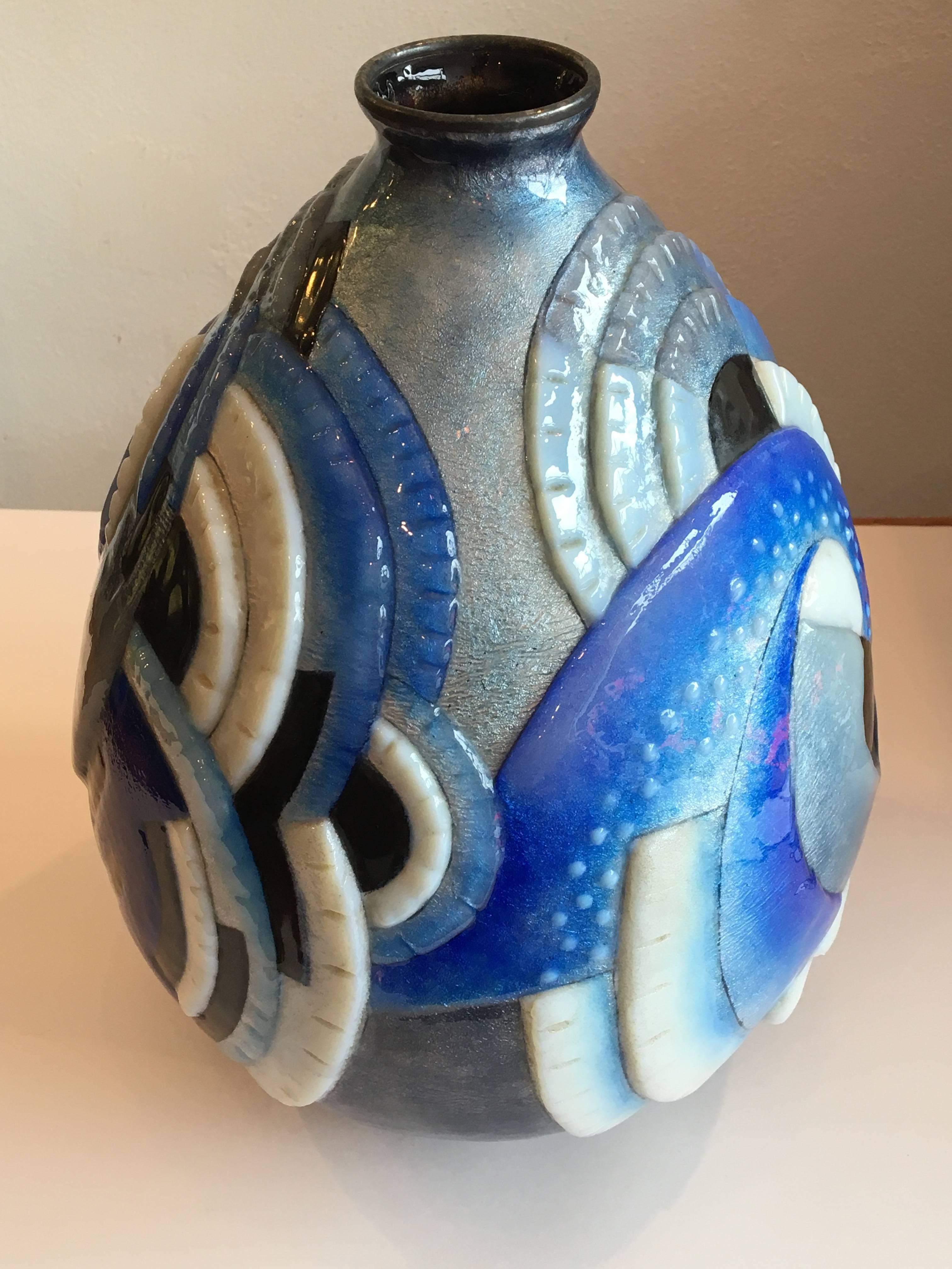 Large enameled copper vase with Geometric pattern of blue, gray, white, black.
White dots on the blue part makes this vase more unique.
Signed, C.FAURE Limoges
Measure: H. 30.5cm, D. 23cm.