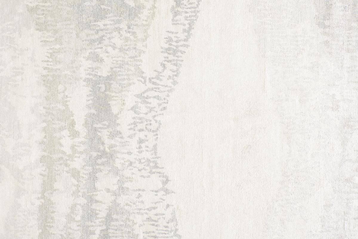 Hand-knotted in India with a stunning subtle palette of ivory and taupe and a medium pile.