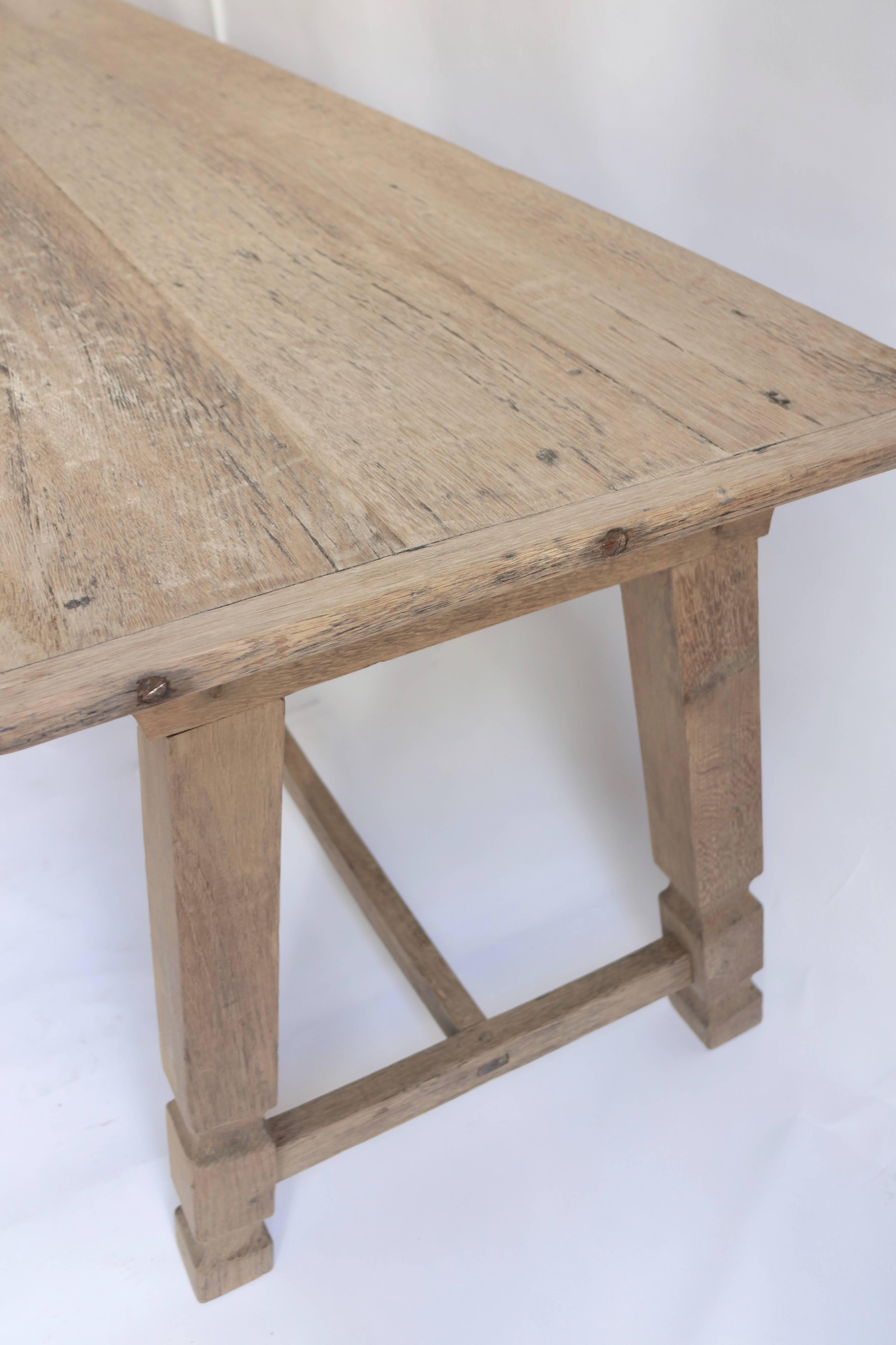 Site table in massive bleached oak, 
French, late 19th century.
Very elegant and stabile construction
possible to use as a dining table.