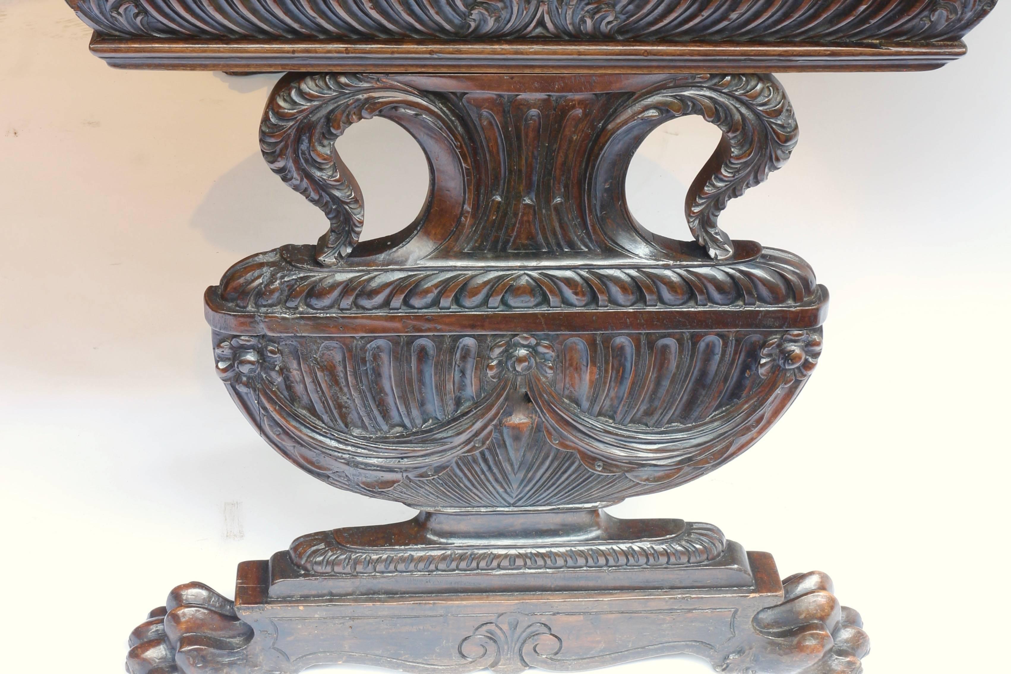 A late Renaissance walnut table with legs in the form of Tuscany vases,
Italy, Florence, tuscany, early 18th century.
The inside of the drawer was made in the late 19th century.