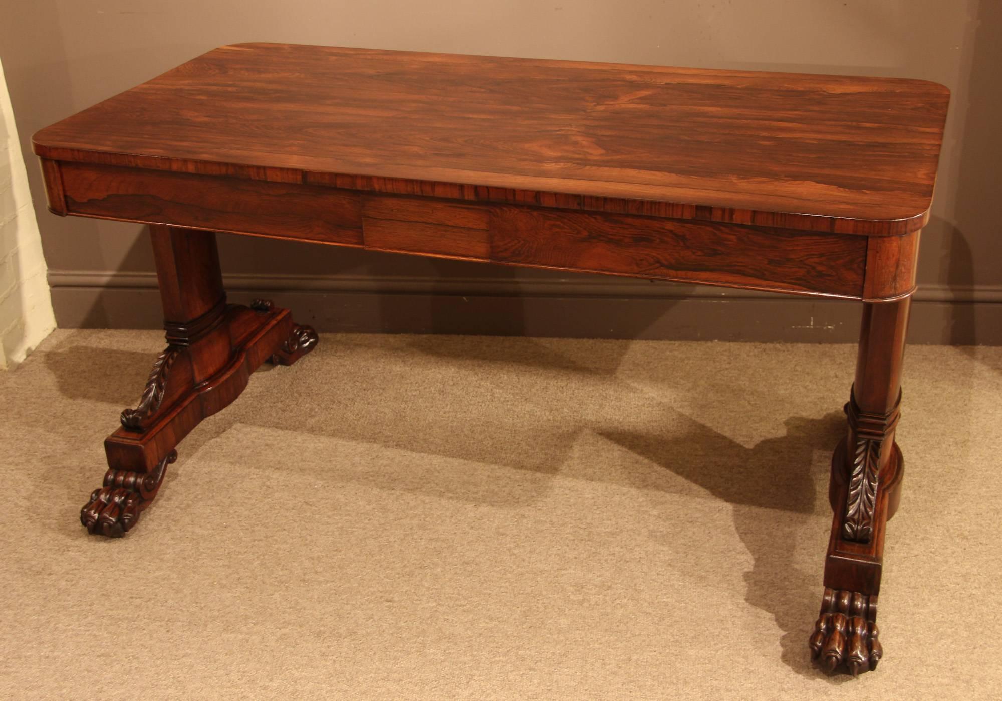 William IV rosewood library table with two drawers, trestle end supports with claw feet, circa 1835.
 
 
All of the items that we advertise for sale have been as accurately described as possible and are in excellent condition, unless otherwise