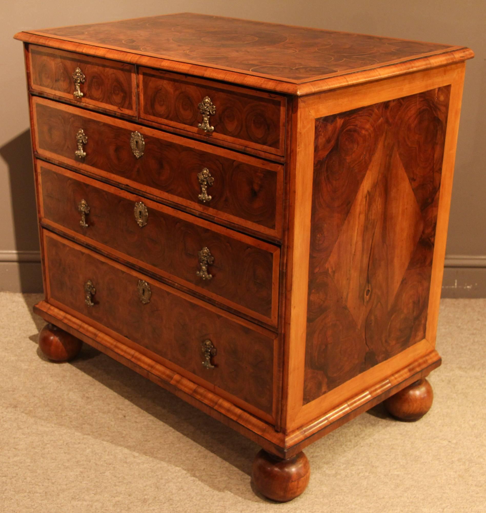 A small William & Mary chest of drawers with olivewood oyster and holly banding with new feet, circa 1690.

All of the items that we advertise for sale have been as accurately described as possible and are in excellent condition, unless