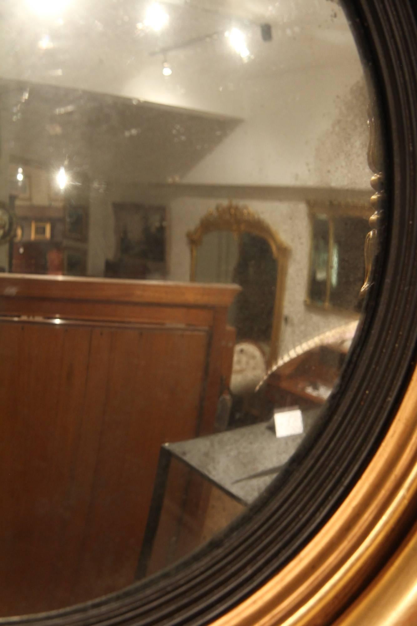 Regency convex butlers mirror, re-gilded, circa 1825.

All of the items that we advertise for sale have been as accurately described as possible and are in excellent condition, unless otherwise stated. Please note that we are also able to arrange