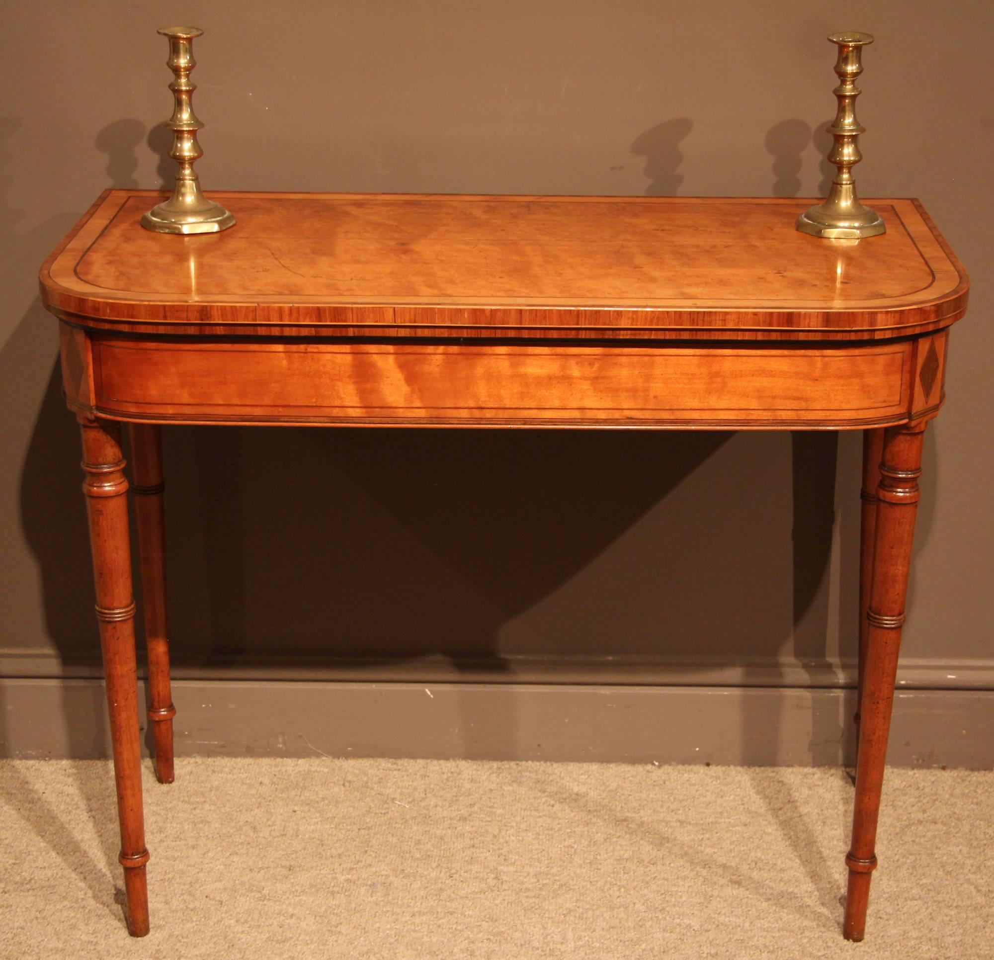 A fine late George III satinwood and rosewood crossbanded card table with boxwood stringing, circa 1810.

All of the items that we advertise for sale have been as accurately described as possible and are in excellent condition, unless otherwise