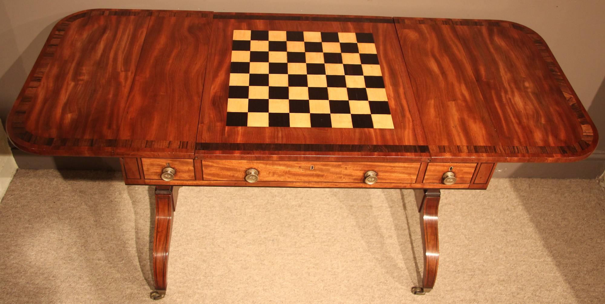 A fine quality period mahogany games or sofa table with original backgammon board and chess board, circa 1820. Label from W.H Jewell Holborn, London.

All of the items that we advertise for sale have been as accurately described as possible and