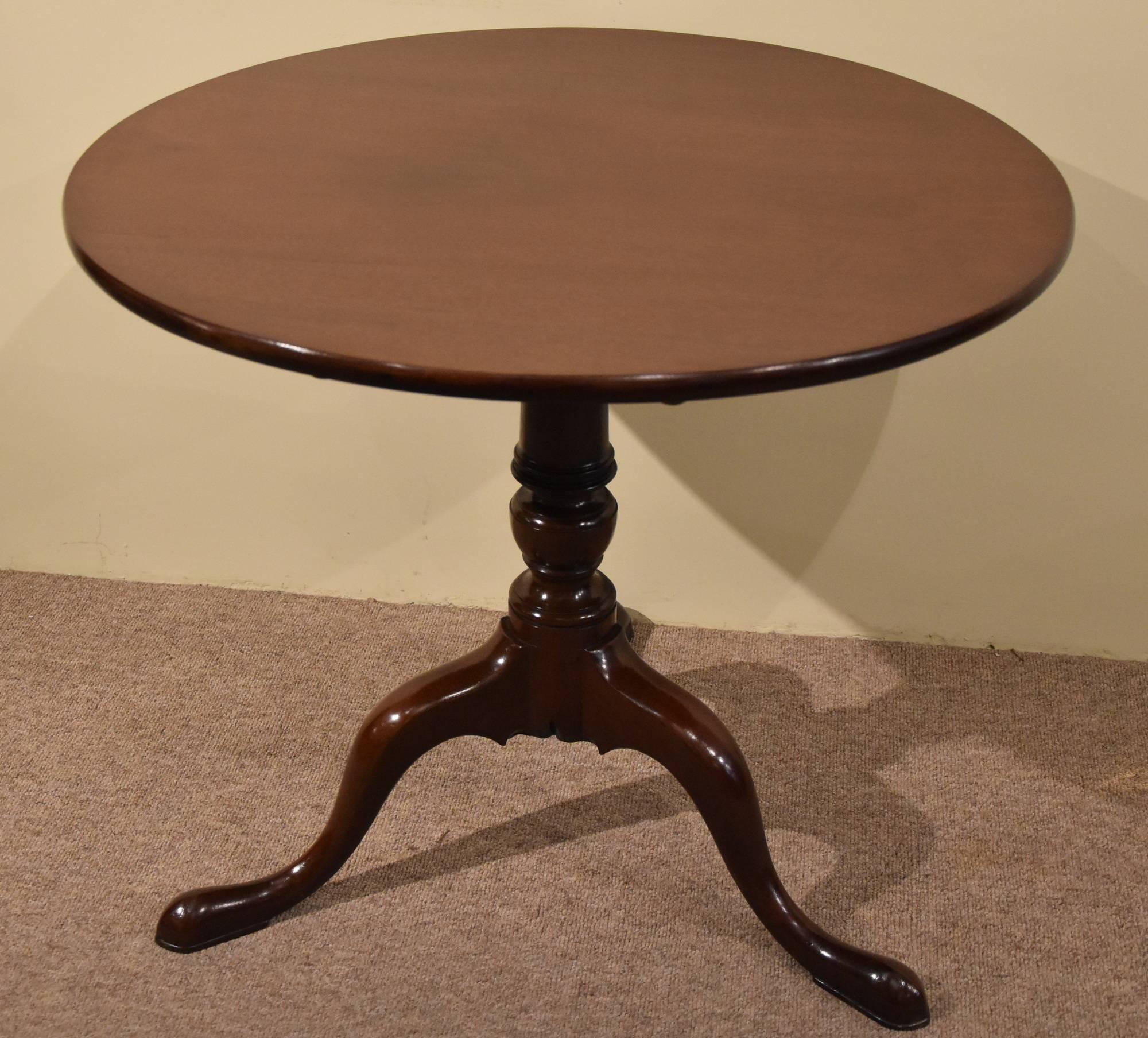 George III mahogany tripod table, circa 1790.

Dimensions:
Height 28.5