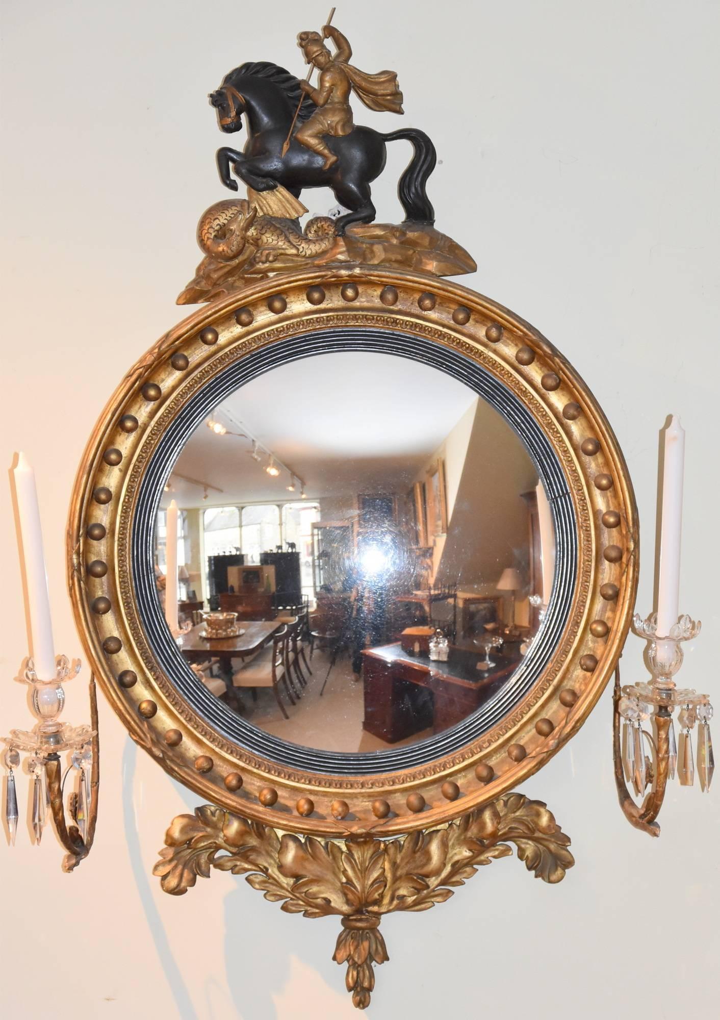 A Regency giltwood convex mirror.

Measures: Height 40