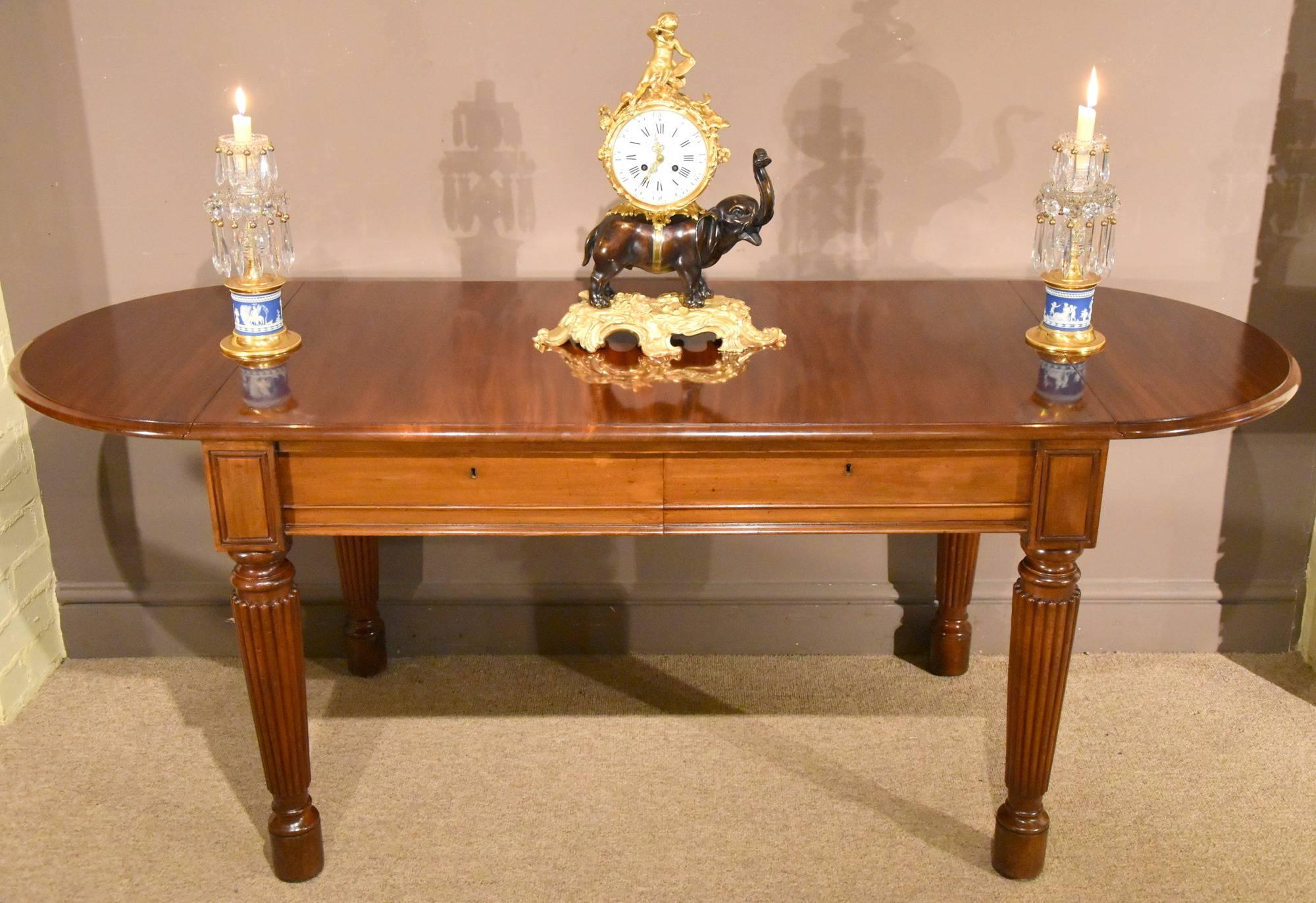 A very fine quality Regency period Gillow Lancaster sofa table. This piece has highly carved flaps supported on fluted legs and castors. The tow drawers with 4248 stamped underneath.

Dimensions:
Height 28.5