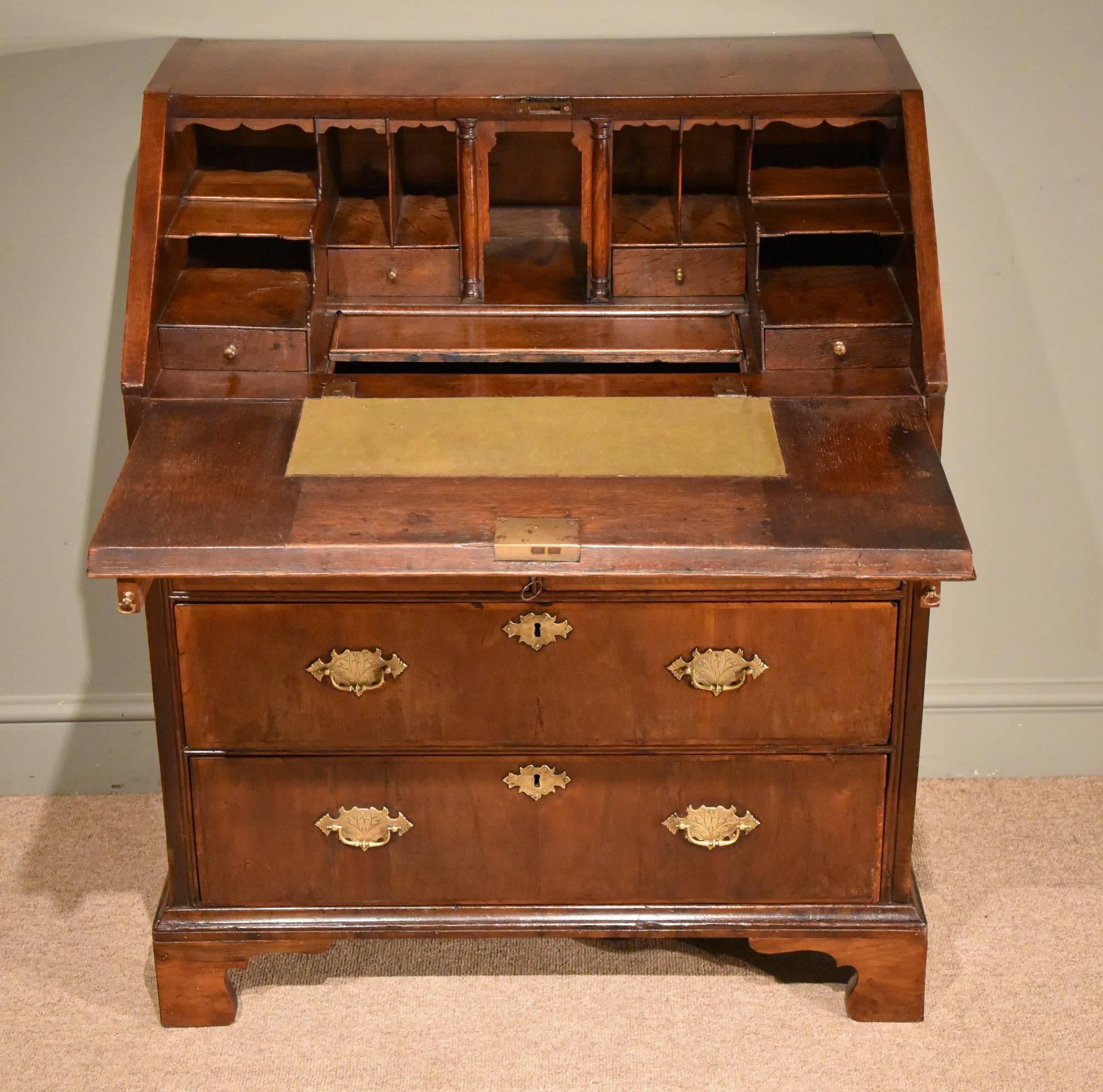 A handsome George II country walnut bureau of superb color

Dimensions:
Height 40.5