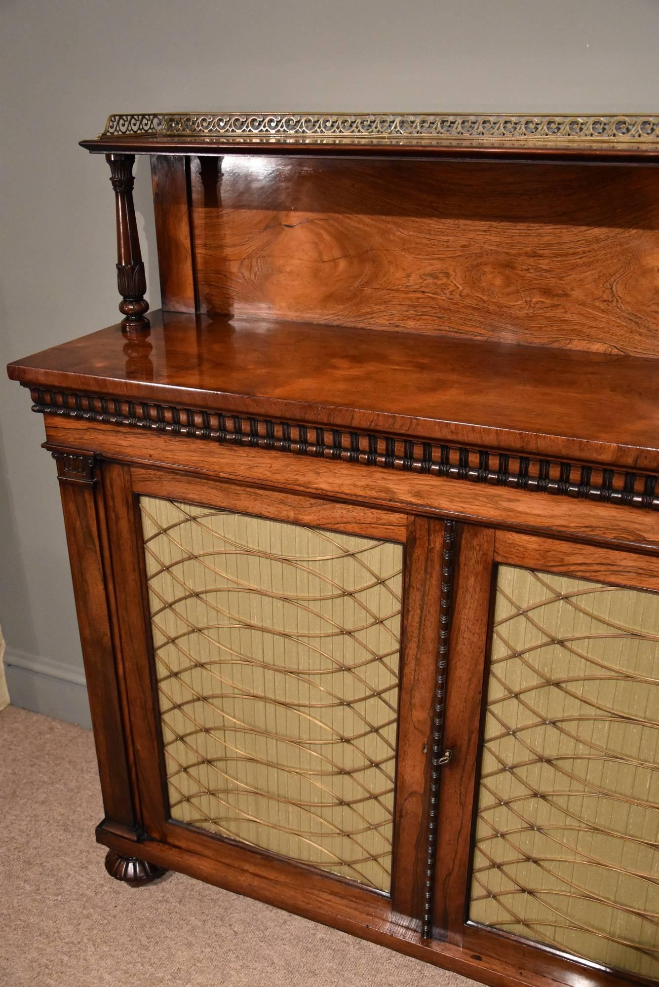 A fine Regency period rosewood chiffonier with a brass galleried ledge back over two brass grille doors, on melon carved feet. In the manner of Gillows, circa 1820.

Dimensions
Height 50