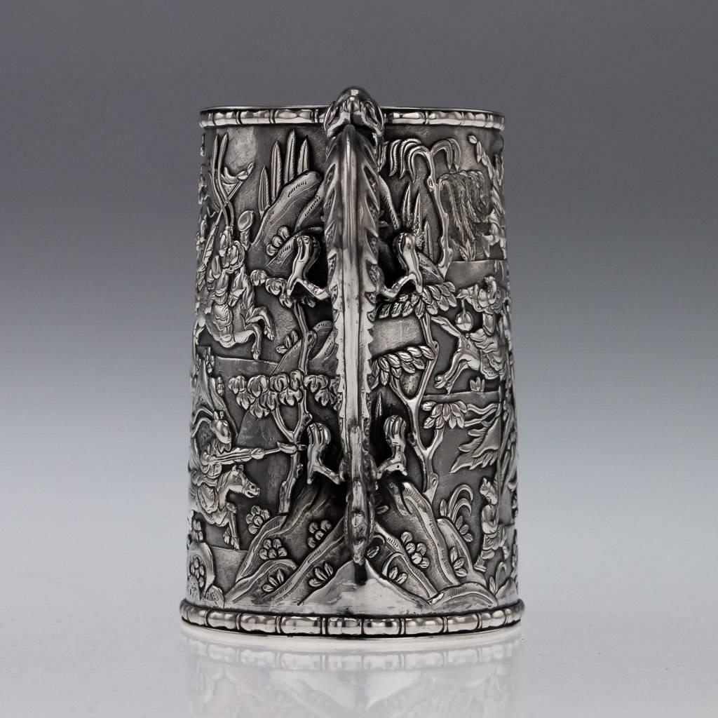 Description.

Antique 19th century Chinese export solid silver mug, particularly large size, tapering form, the body is applied with beautifully cast battle scenes in relief depicting horsemen fighting amongst hills and trees, very detailed and