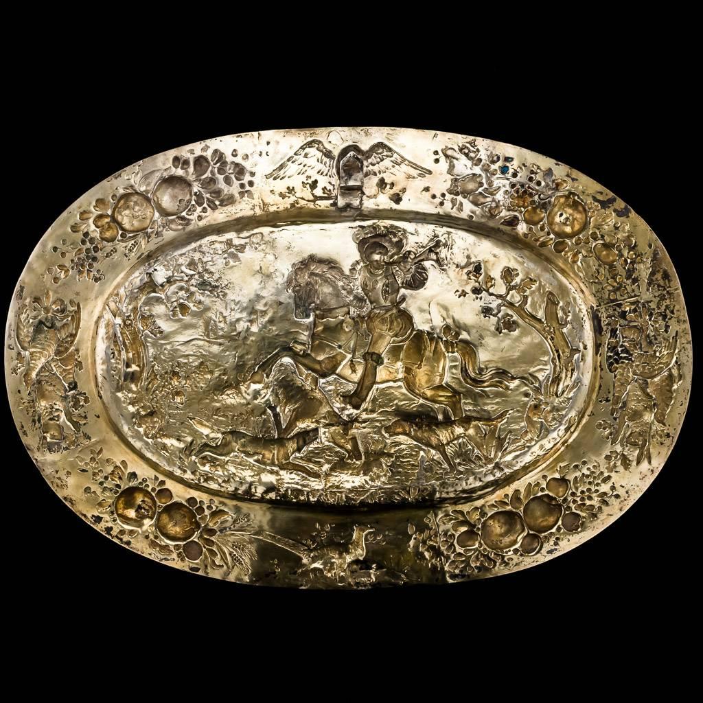 
Description

Antique 19th century German solid silver wall charger/hunting sideboard dish, good size and impressive weight, gilt, of oval form in the style of the 16th-17th century silver sideboard dishes/chargers, the border embossed with