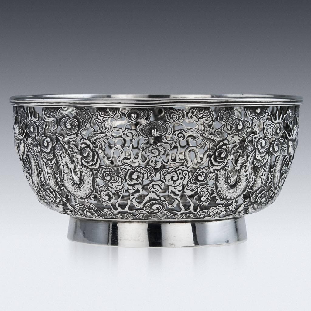Antique 19th century rare Chinese export Wang Hing solid silver bowl, the sides are profusely chased and pierced depicting dragons chasing the flaming pearl of wisdom among clouds, good size and stunning workmanship.

The base is Hallmarked