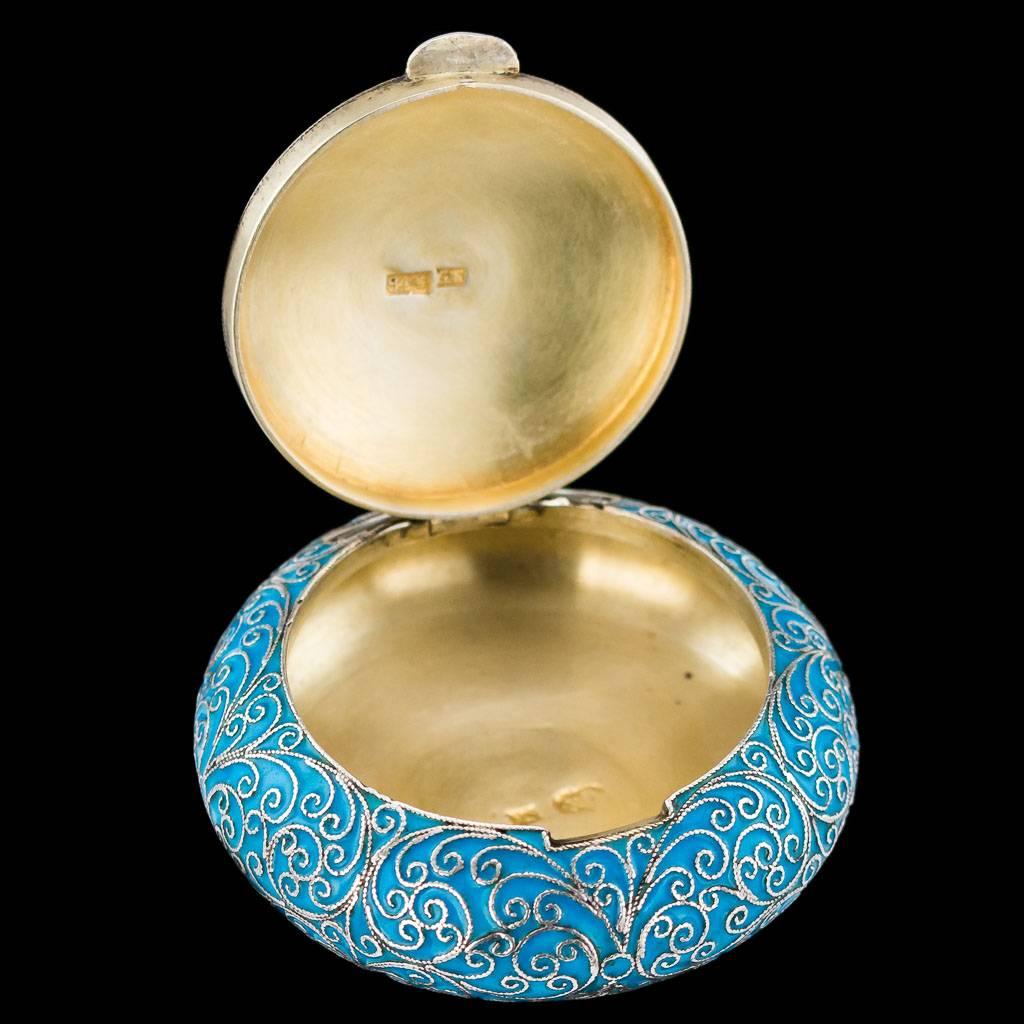Description

Antique 19th century Imperial Russian parcel gilt solid silver and cloisonne' enamel snuff box, of circular form, all of the surface enamelled in opaque blue with pertruding filigree floral design and a white bead boarder around the
