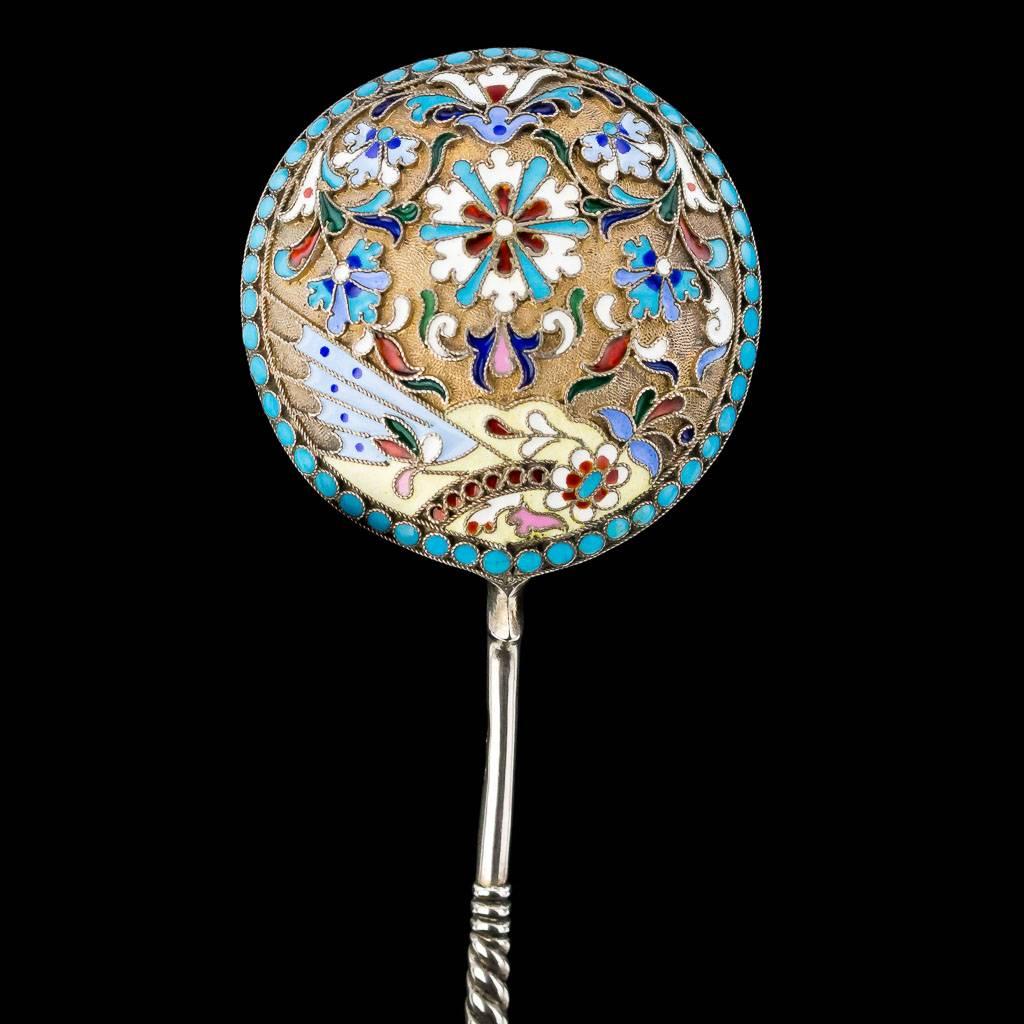 Description:

Antique 20th century Imperial Russian solid silver and cloisonne' enamel spoon, the round bowl is applied on reverse with multi-coloured polychrome enamel scrolls, with blue beaded boarder on matted silver gilt ground. The twist stem