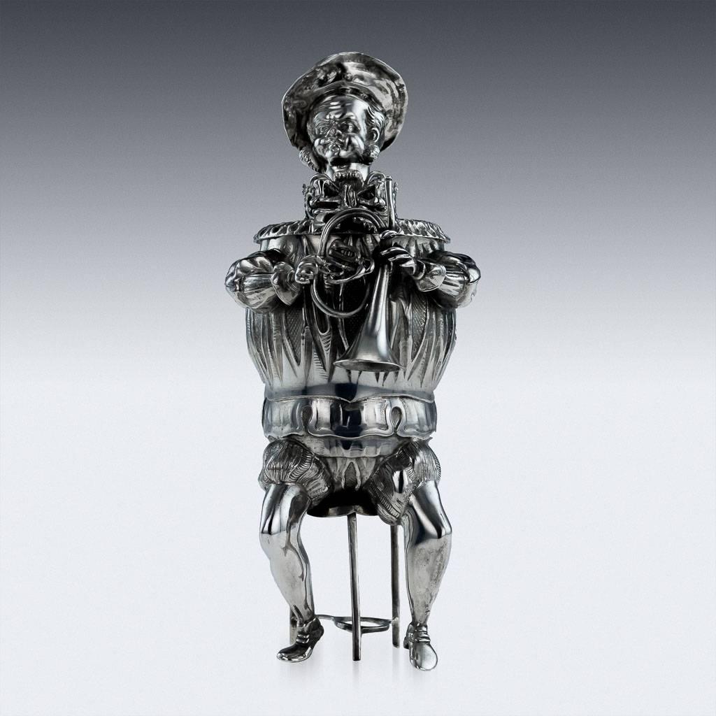 Description

Antique 20th century German solid silver novelty cup modelled as a musician seated on chairs, with a cast round body and sprung head, plumed hat and ruffled collar, removable tops. Hallmarked German silver 800 standard, Hanau, dates