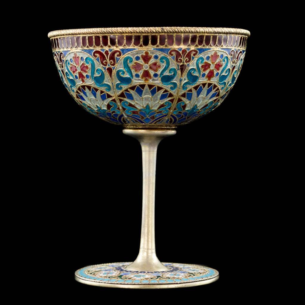 Antique 19th century Imperial Russian solid silver and plique-a-jour enamel sherbet cup, the bowl decorated with polychrome panels of stylized flowers and scrolls in red, blue, purple and white.
Standing on circular foot, enamelled with flowers and