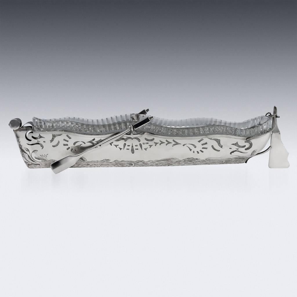 Description.

Antique 20th century Imperial Russian solid silver and cut-glass large caviar boat centerpiece, silver body realistically modelled as a fishing boat, applied with oars and twist rope decoration, the silver body has pierced decoration