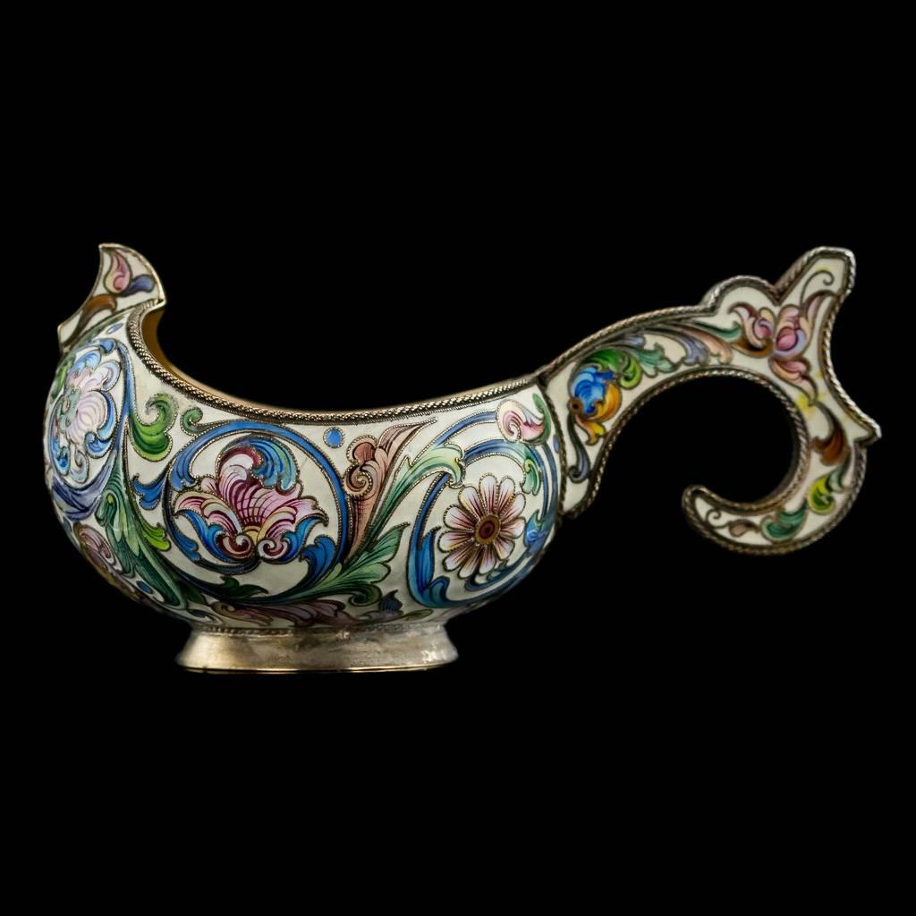 Antique 20th century rare imperial Russian solid silver gilt and cloisonne' enamel kovsh, of traditional form on plain circular foot with raised prow and hook handle, beautifully decorated with various multi-coloured polychrome cloisonne' enamel