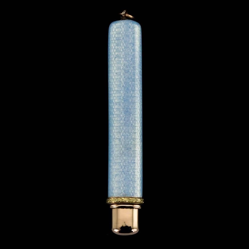 Antique 20th century imperial Russian two-colour gold-mounted guilloche enamel pencil holder, of flattened rectangular form, enameled in translucent ice blue over a wavy guilloché ground, the gold collar decorated with gold leaf boarder.

Pencil