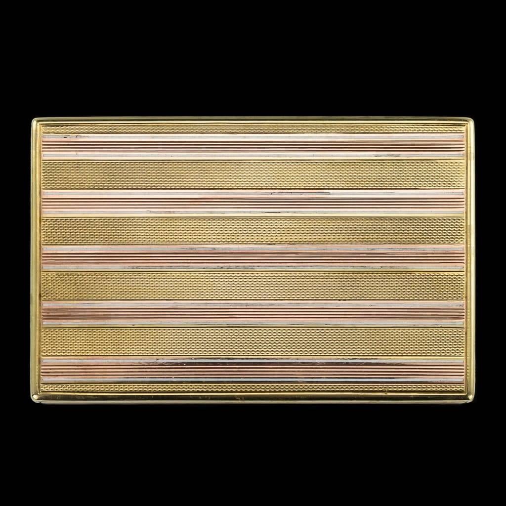 Antique 20th century Imperial Russian Faberge jewelled two-color gold and enamel cigarette case, with alternating horizontal engine-turned panels and white opaque enamel stripes, the cigarette case's hinged cover with a diamond-set