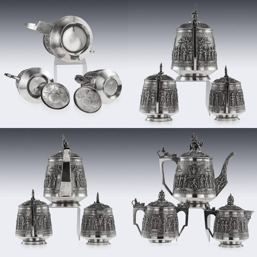 Description:

Antique 19th century Indian Colonial Solid Silver three-piece tea set on tray, comprising of teapot, covered sugar bowl, cream jug and tray, each straight tapered body is profusely and beautifully repousse' decorated with a religious