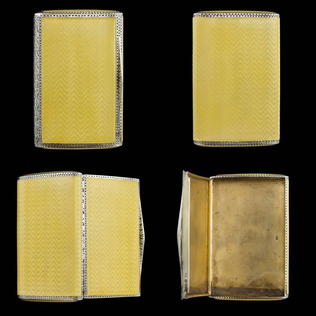 Antique 20th century Art Deco solid silver-gilt and guilloche enamel cigarette case, rectangular form with rounded corners, body enameled in translucent yellow over a chevron ground, silver is richly parcel gilded.

Both sides hallmarked English