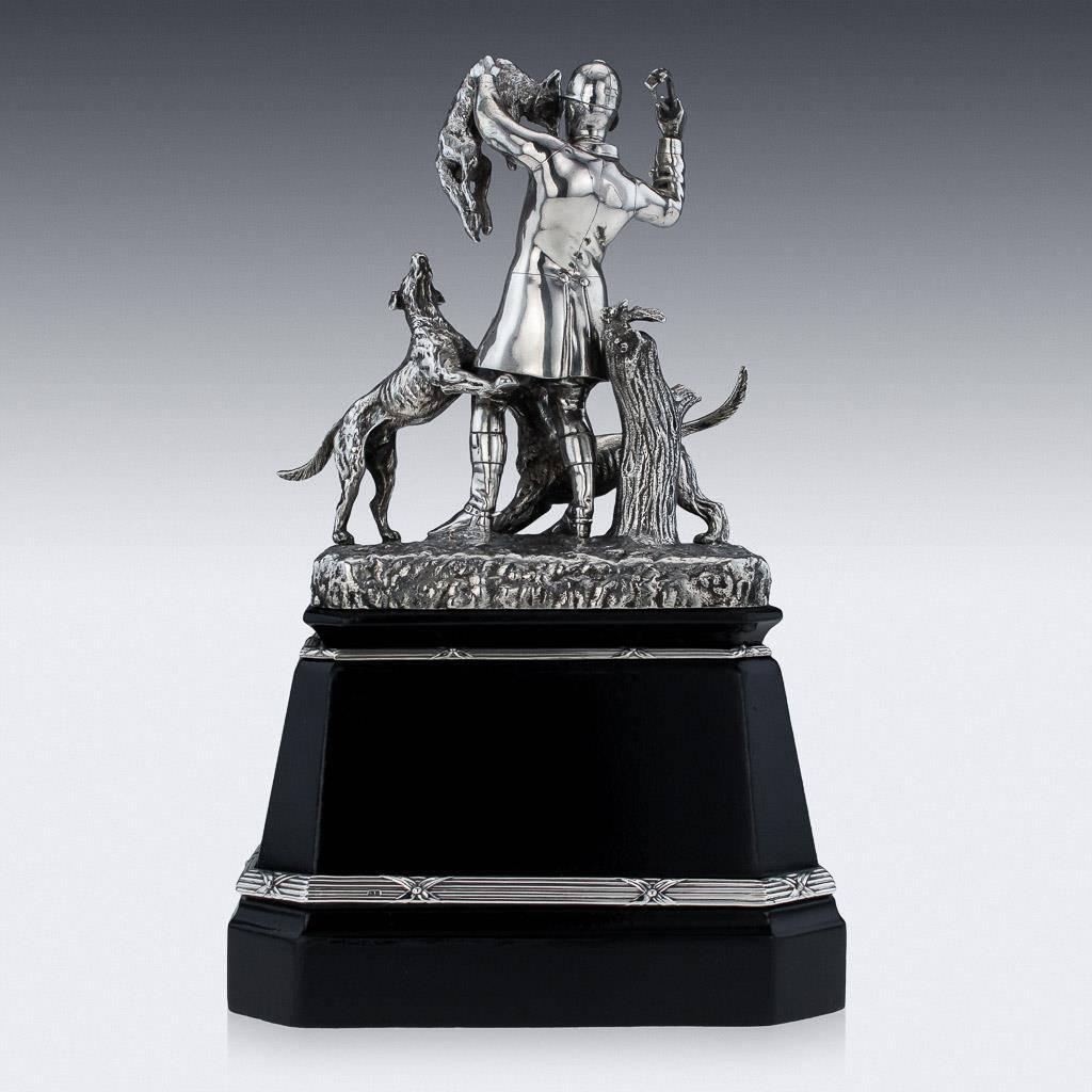 Description: 

Antique 19th century Victorian solid silver important figural hunting statue, dipicting a huntsman holding a fox and his hounds at his feet. Standing tall on an ebonized plinth applied with an engraved plaque 'Presented to W.J