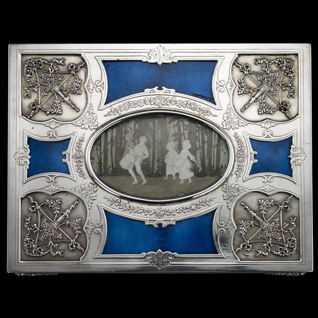 Antique 20th century French solid silver and enamel casket, rectangular shaped with engine-turned decoration to the sides, the hinged cover is beautifully part guilloche enamelled and decorated in French Empire style with floral basket spreads to