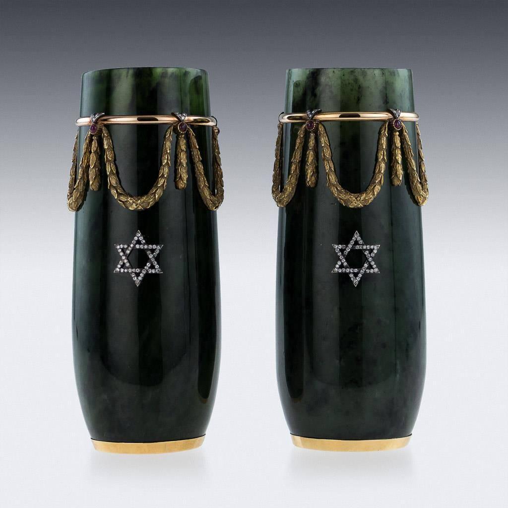 Stunning 20th century Russian style pair of vases, curved shaped body applied with laurel garlands suspended from a gold ring set with bright diamond and cabochon ruby in ‘V’ junctions. Both sides are set with a star of David in platinum and