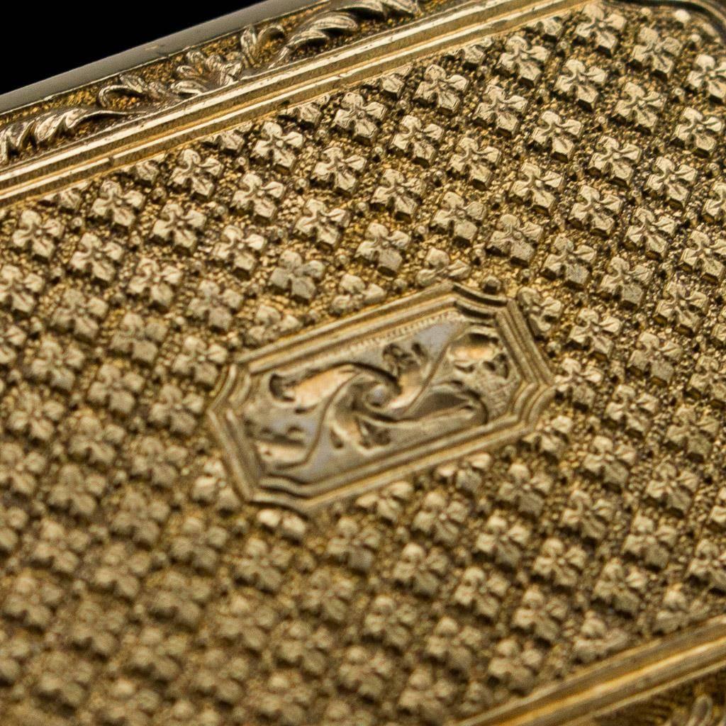 Antique 19th century William IV solid silver vinaigrette, of rectangular form, richly gilt, both sides featuring a lovely design depicting scrolling foliage and a repeated stylized texture, the top engraved with initials, it opens to reveal the