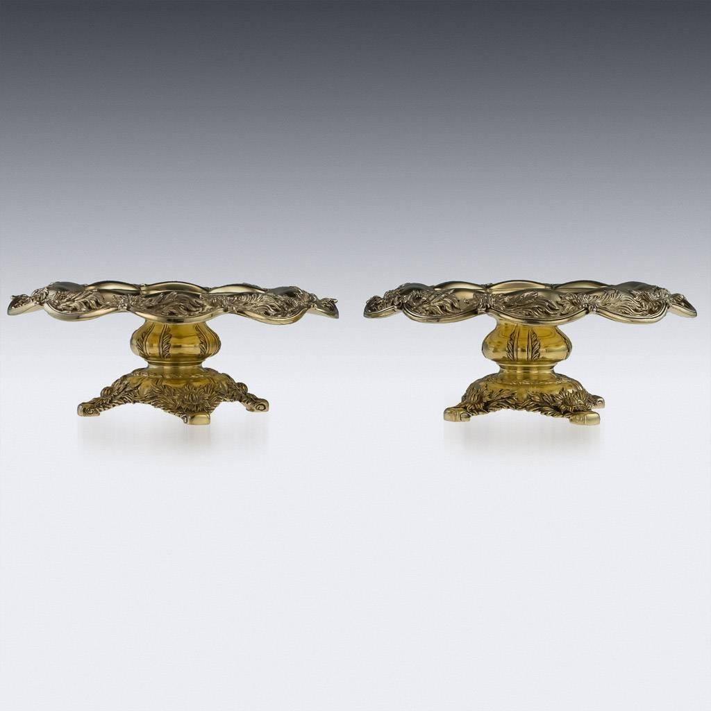 Antique 19th century, American rare and magnificent pair of solid silver-gilt chrysanthemum tazzas, circa 1887. The central part of the tazzas is engraved with initials and dated. The pair are particularly early for this pattern and are very heavy