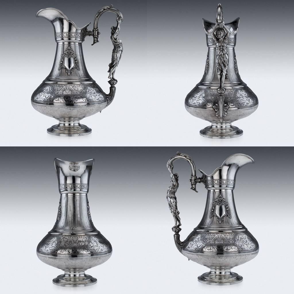 Antique 19th century French large solid silver figural ewer and basin, raised on a circular foot applied with cast handle modelled as a female figure, the tall baluster body is intricately hand engraved on engine turned ground with scroll work and