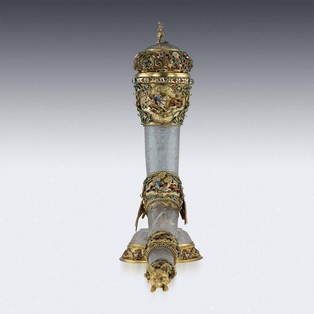 Antique 19th century, Austrian exceptionally rare solid silver gilt, enamel and rock crystal hunting horn with cover. The rock crystal engraved with chimeras among scrollwork, with silver gilt mounts with pierced and enamelled hunting scenes amid