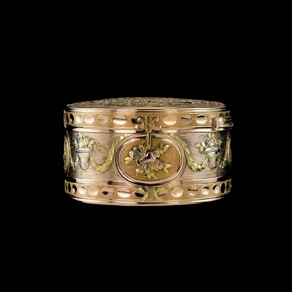 Antique 18th century French magnificent three-coloured 18-karat gold snuff box of oval form, chased with pastoral and musical trophies in oval reserves within flowers and husk garlands on a matted ground.
Hallmarked with indistinct 18th century