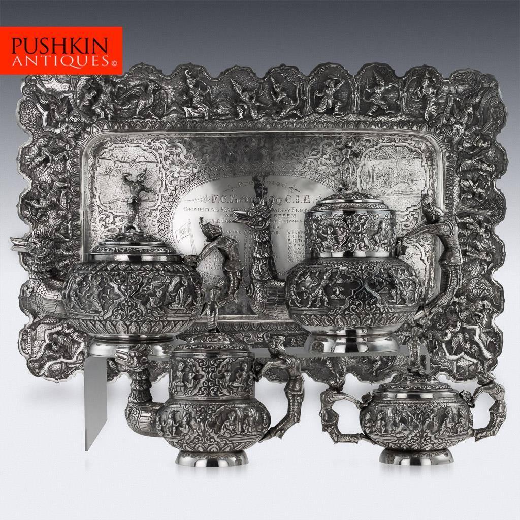 Antique early-20th century rare and magnificent Burmese, Myanmar solid silver four-piece tea and coffee set on a presentation tray, comprising of teapot, coffee pot, lidded sugar bowl, lidded cream jug, each piece is highly-decorative, chased and