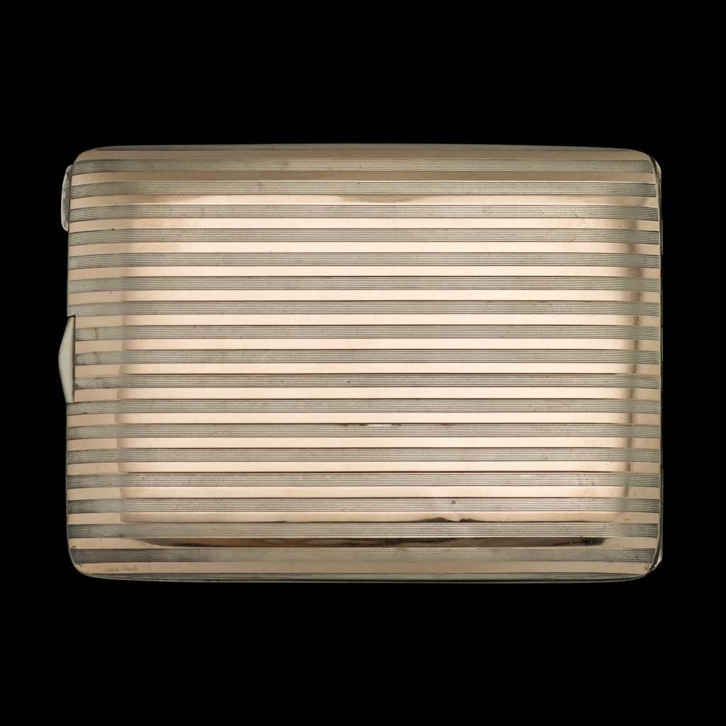 Description

Antique 20th century Cartier Art Deco 14-carat gold and solid silver cigarette case, rectangular form featuring a stylish reeded design with applied 14-carat gold bands, the cover is engraved with initials "ETU".

The