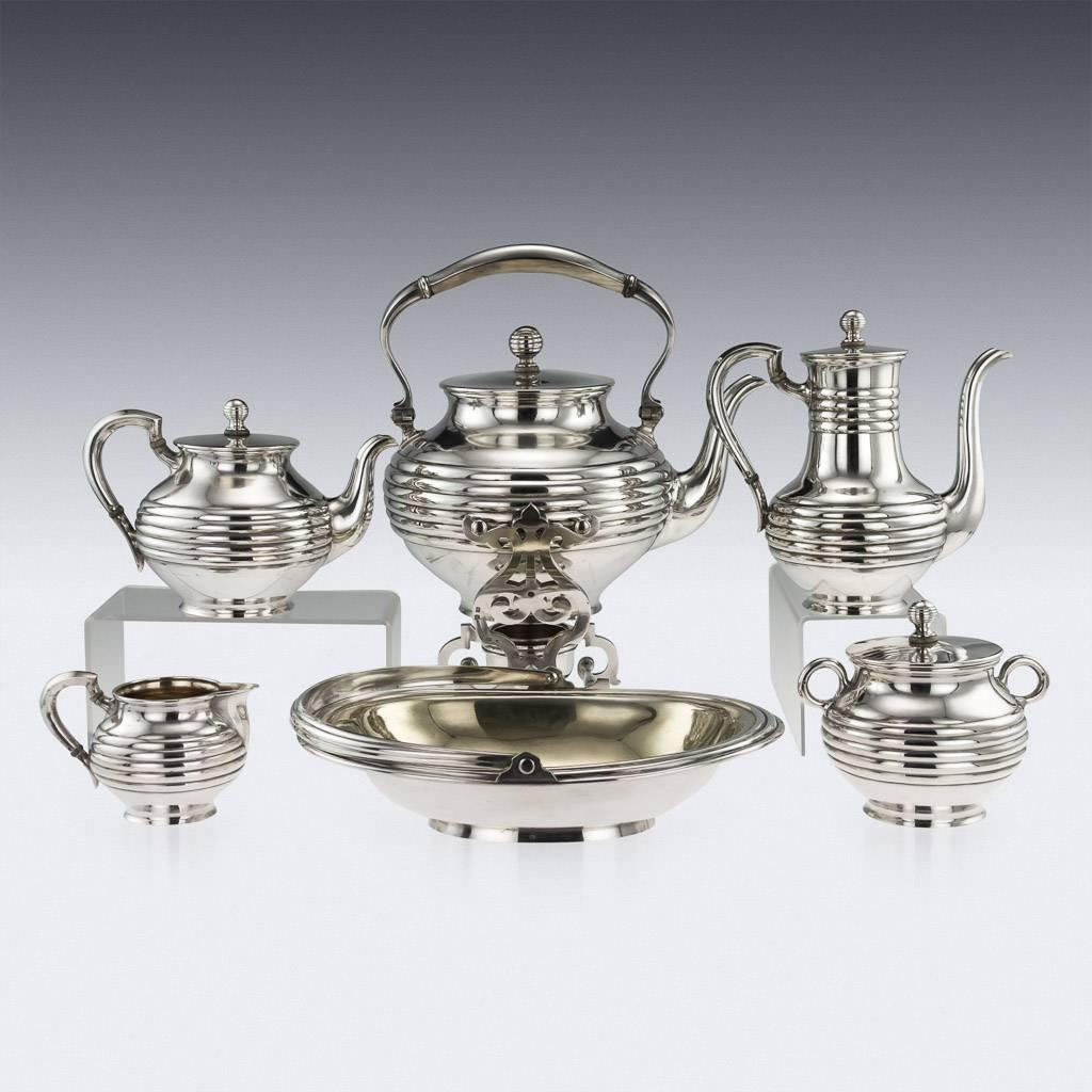 Antique 19th century rare and impressive imperial Russian solid silver six-piece tea service on tray, comprising of hot water kettle, teapot, coffee pot, covered sugar bowl, cream jug and cake basket, inside richly parcel gilt, of partially fluted