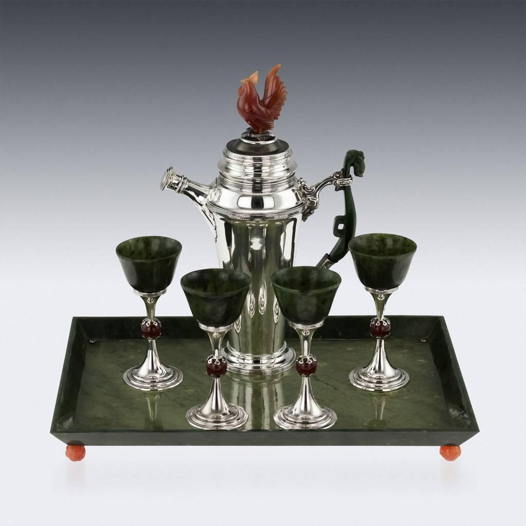 Antique 20th century unique Art Deco solid silver and hard-stone mounted cocktail set on tray, beautifully designed in French Art Deco taste, the silver decorated with a Grecian turn-key boarders, shaker mounted with a Chinese style carved spinach