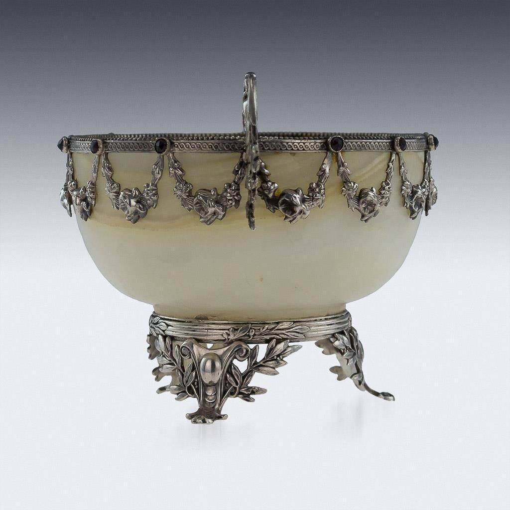 Antique 19th century Austrian solid silver and gem-set white agate bowl, the round bowl mounted on top and the body applied with suspended laurel garlands and old cut garnet in intersections. Twin handles imitating scrolling foliage and flowers.