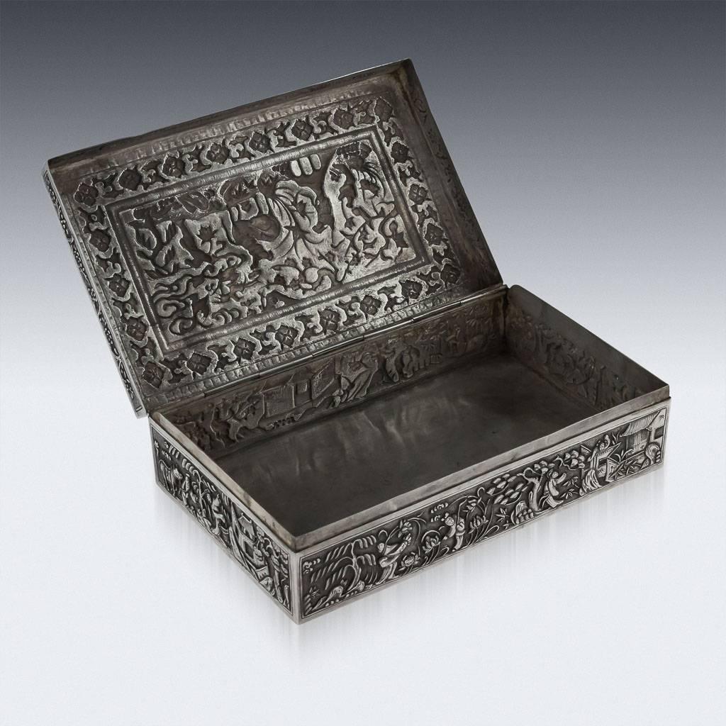 Antique 19th century rare Chinese solid silver large decorative box, of rectangular form, decorated in repousse' high relief, on very finely tooled matted ground, depicting various figures in a landscape and amongst palaces. The box is particularly