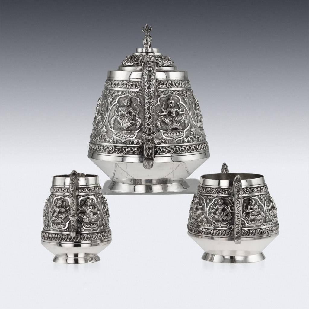 Description

Antique 19th century Indian Colonial solid silver three-piece tea set, comprising of teapot, sugar bowl, & cream jug, each straight tapered body is profusely and beautifully repousse' decorated with panels of Shiva in various posses,