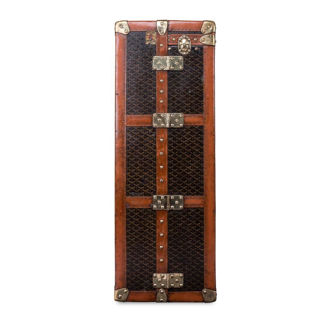 A very unusual and elegant early 20th century Goyard wardrobe trunk, with brass corners and lozine trim and covered in the world famous chevron pattern canvas. Over recent years the brand has been relaunched and has taken the world of fashion by