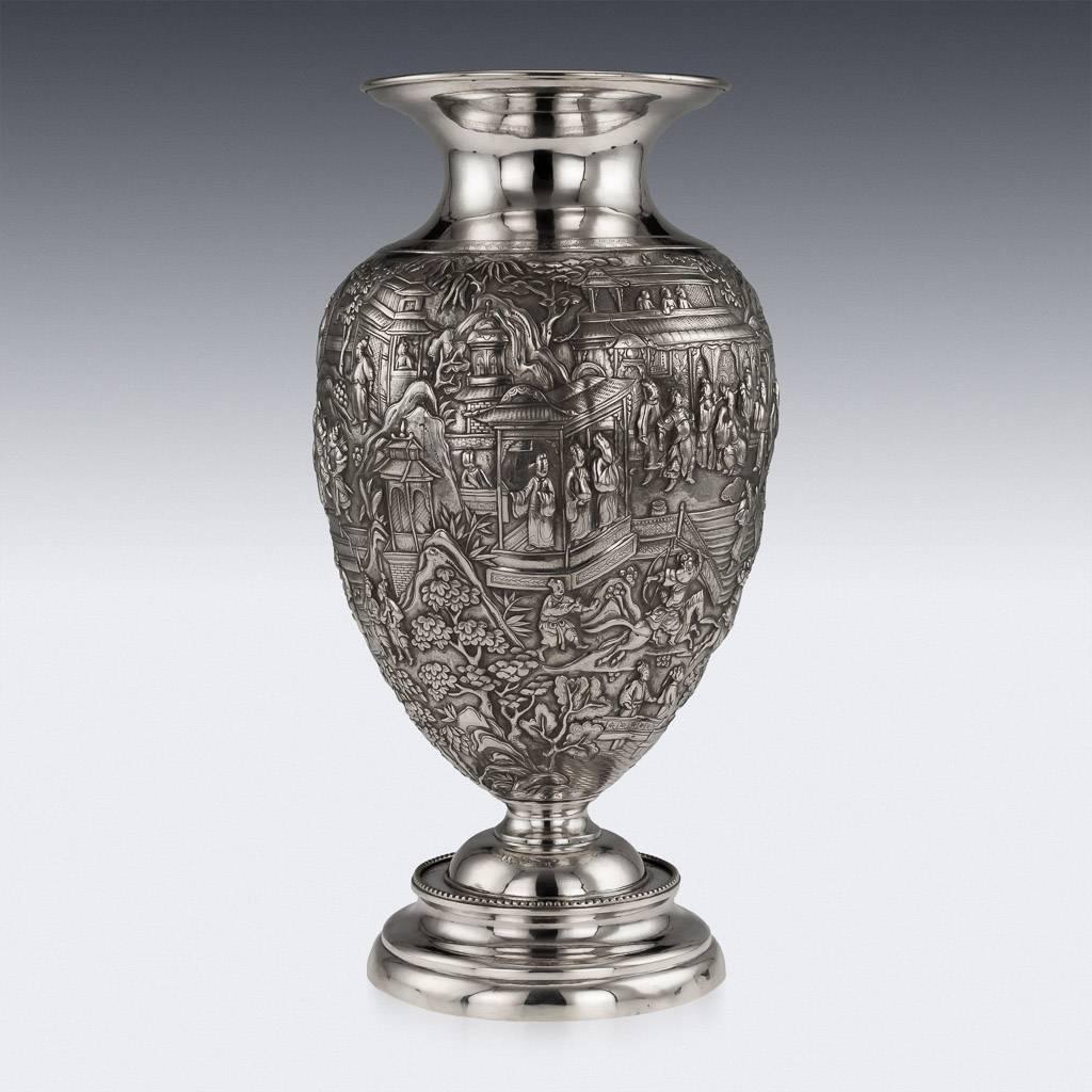 Antique 19th century rare Chinese Export solid silver vase, impressive and exceptionally fine, baluster form body fully chased and embossed with a dense scene of battles and receptions before nobility, the plain neck engraved with a floral band,