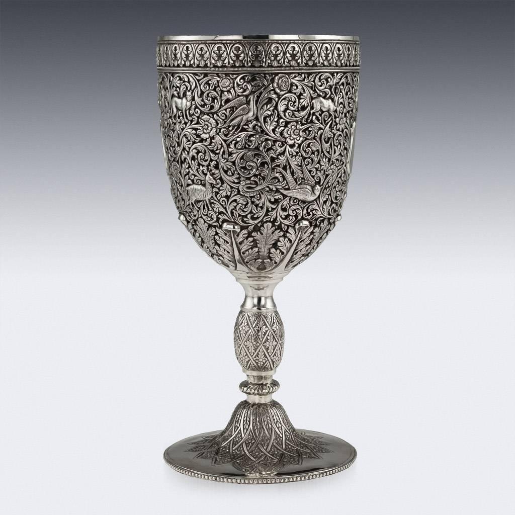 Description

Antique 19th century Indian Kutch (Cutch), Bhuj, Gujarat region, beautifully handcrafted solid silver large goblet, all over finely chased with scrolling leaves, scroll patterns on a finely tooled and pierced background, the main body