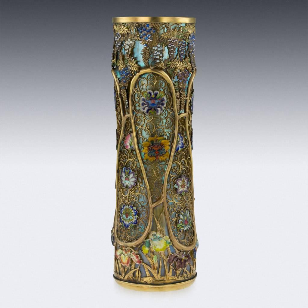 Description

Antique late-19th Century Spectacular Japanese Meiji period Loetz blown glass vase with raised endless loops under an iridized silver blue finish, overlaid with an elaborate design of silver gilt scrolls mounted with finely enameled