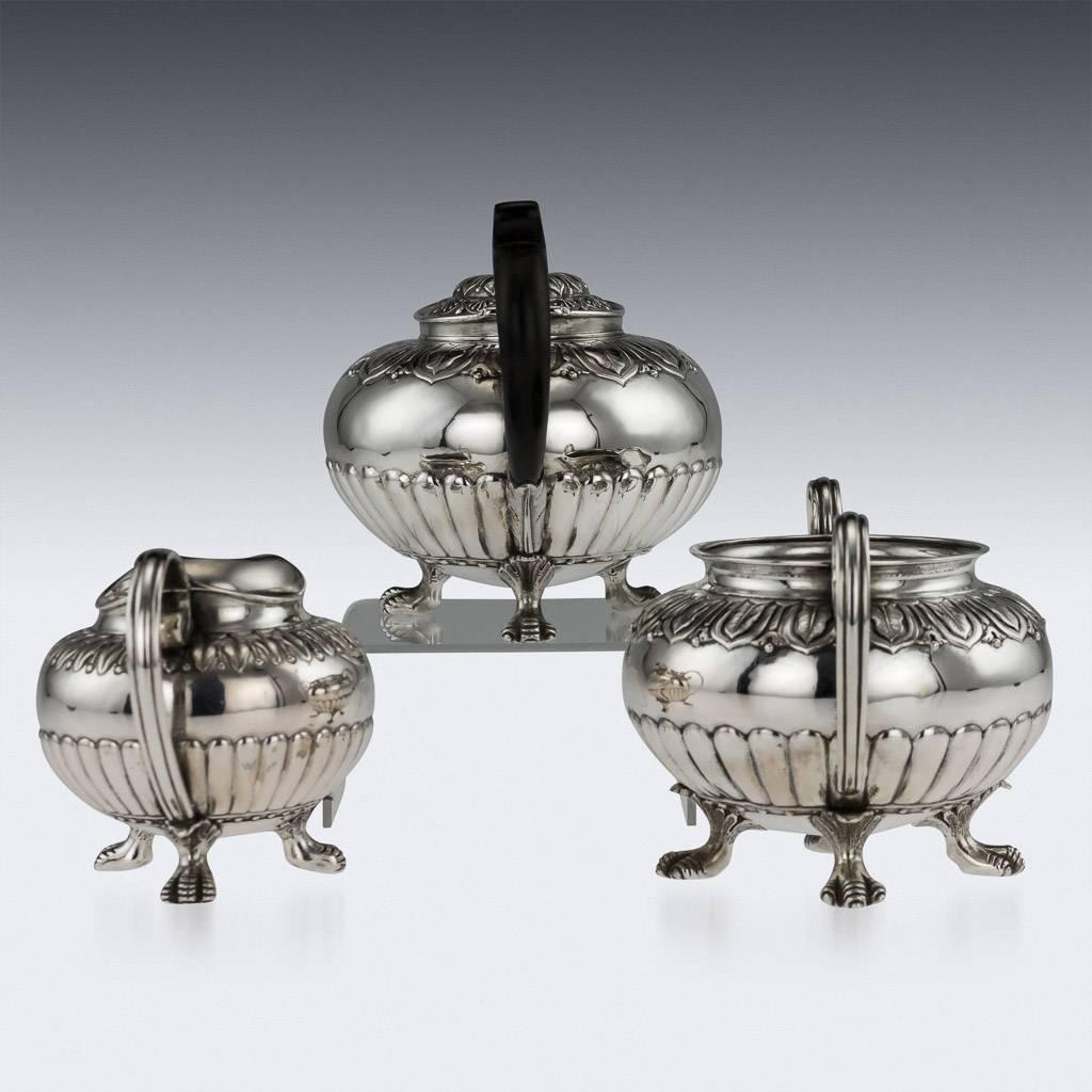 Description

Antique 19th century Chinese Export exceptionally rare solid silver three-piece tea set, decorated in Regency style with acanthus leaf and half fluted boarders, resting on three bird of pray claw shaped feet and applied with scroll