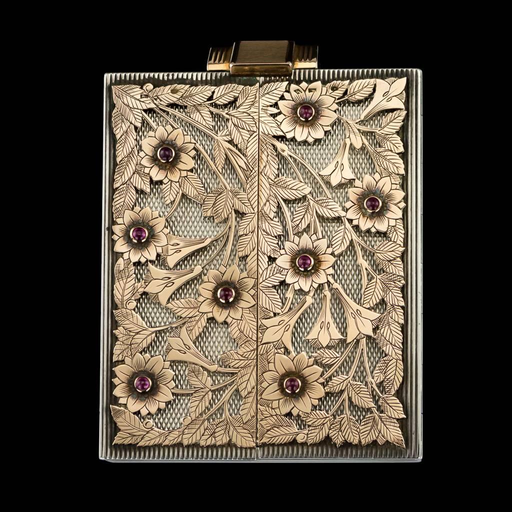 Antique 20th Century Boucheron Art Deco 18k gold & solid silver compact, rectangular form featuring a stylish reeded design with applied solid gold pierced floral design decorated with ruby cabochons. All parts hallmarked with French silver & gold