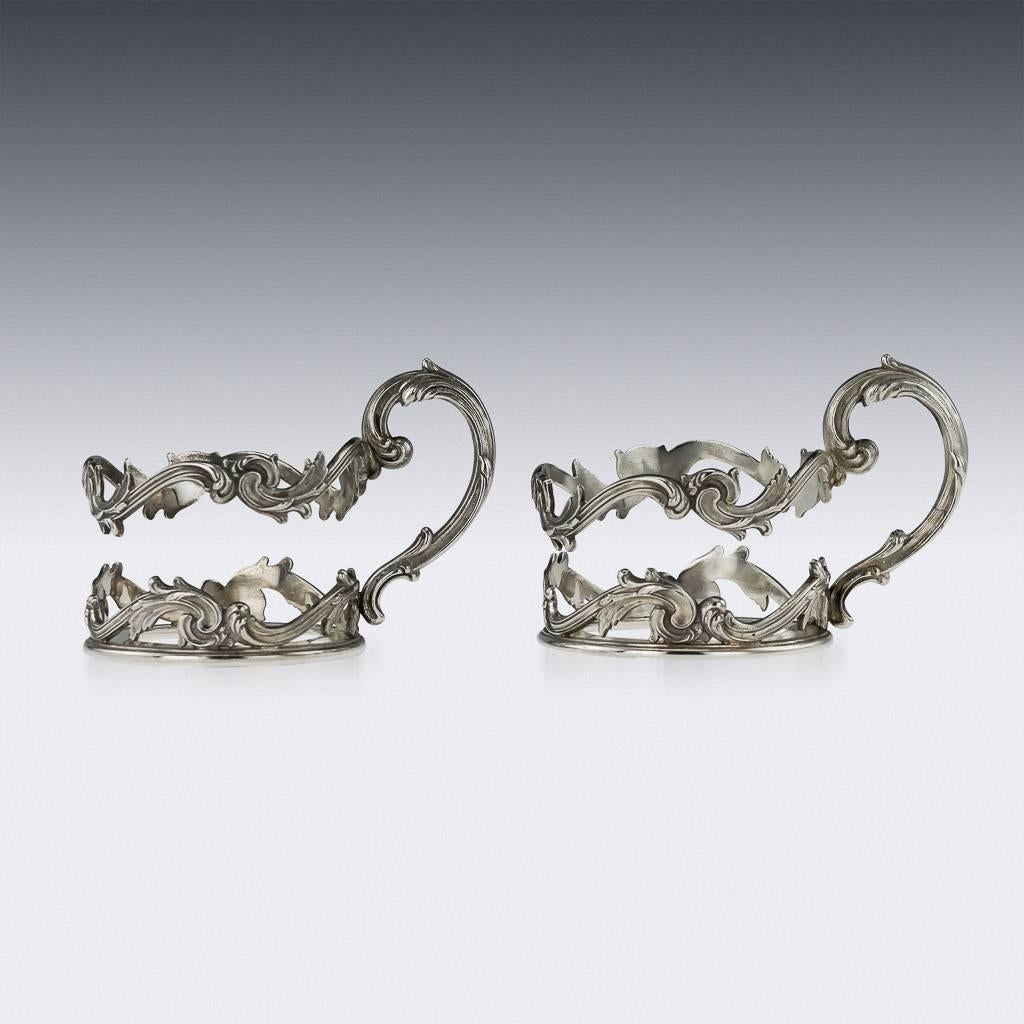 Description

Antique 20th century pair of Imperial Russian Faberge solid silver tea glass holders, frame beautifully cast in rococo style. Each hallmarked Russian silver 84 (875 standard), Moscow, year 1896-1908, Maker K.Faberge under the Imperial