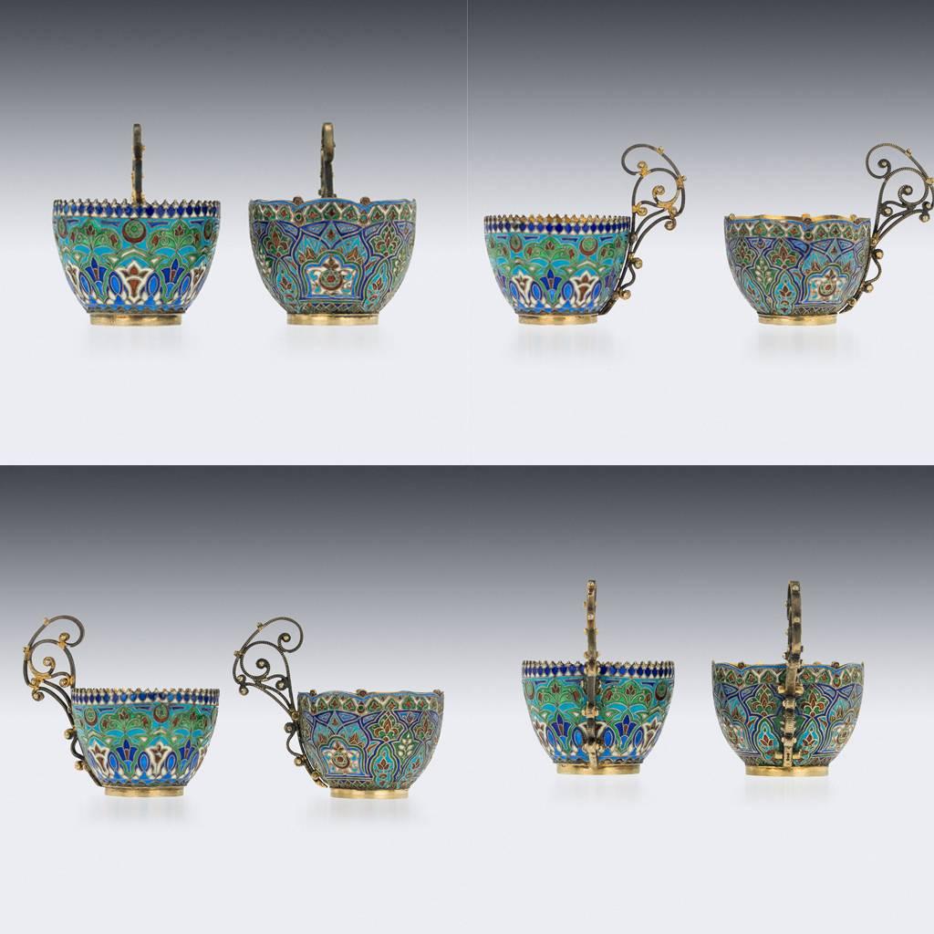 Antique 19th century Austrian solid silver and cloisonne enamel pair of coffee cups and saucers, each part gilt and beautifully enameled with varicolor flowers, scrolling foliage, Islamic calligraphy, stylized scroll handle. Made especially for the